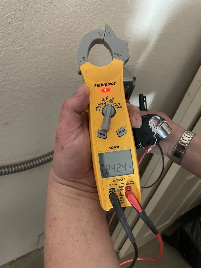 Voltage testing with clamp meter during Recessed Lighting Installation in Ellisville